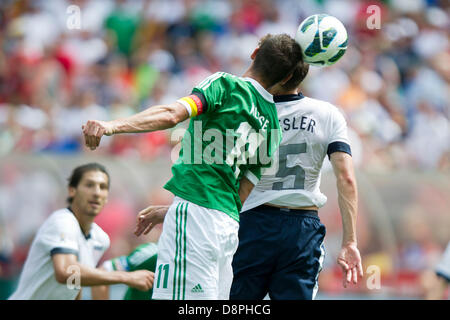 Washington DC, USA. 2nd June 2013. German National Team forward Miroslav Klose (11) heads the ball past U.S. Men's National Team defender Matt Besler (5) during the U.S. Men's National Team vs. German National Team- Centennial celebration match at RFK Stadium - Washington, D.C. The U.S. Men's National Team defeats Germany 4-3. Credit:  Cal Sport Media/Alamy Live News Stock Photo