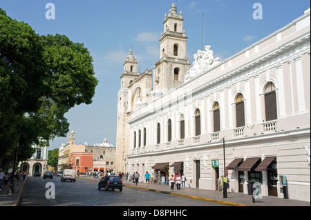 The Bishop's Palace or Peninsula Athenaeum and cathedral on Plaza Grande, Merida, Yucatan, Mexico Stock Photo