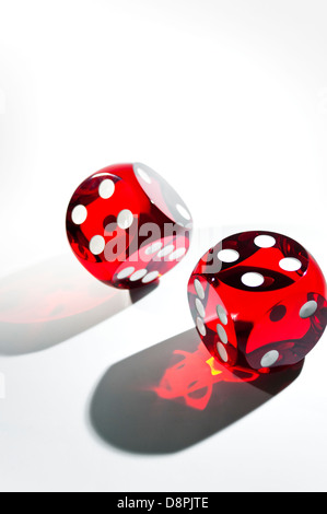 Red rolling dice on white background Stock Photo