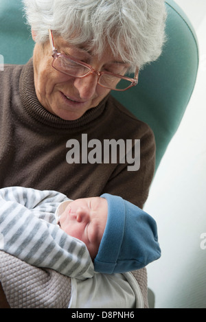 Grandmother holding newborn baby Stock Photo