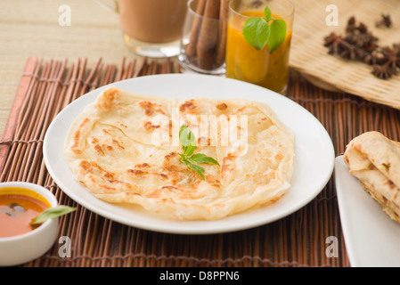 roti canai flat bread, very famous mamak food in malaysia, usually served wtih curry sambal or sugar Stock Photo