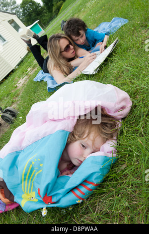 Family relaxing outdoors Stock Photo