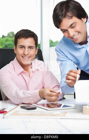 Happy Architects Working Together Stock Photo