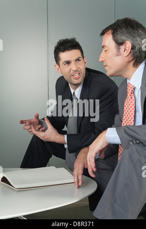 Businessmen discussing work Stock Photo