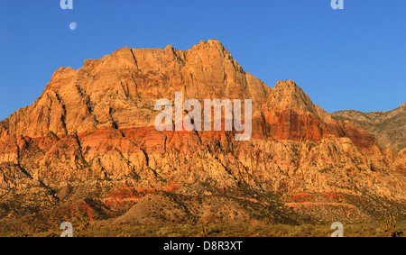 Scenic view of the moon shining over Red Rock Canyon, Nevada at sunrise Stock Photo
