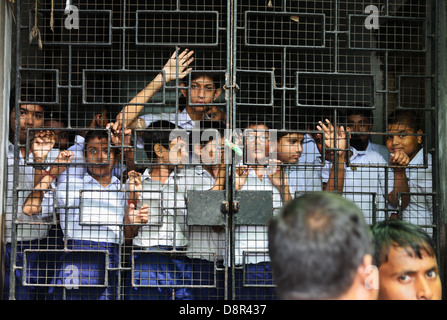 Pupils behind bars, College Street, Kolkata, India Stock Photo
