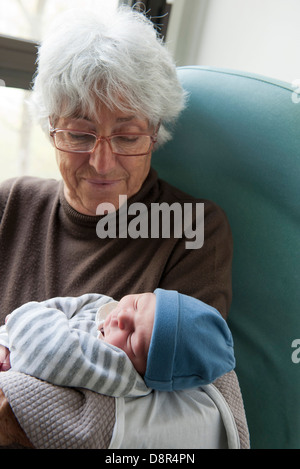 Grandmother holding newborn baby Stock Photo