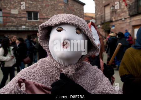 Carnival. The Devils of Luzon. A man disguised in a mask accompanying Devils in their tour of the village Stock Photo