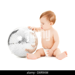 child playing with disco ball Stock Photo