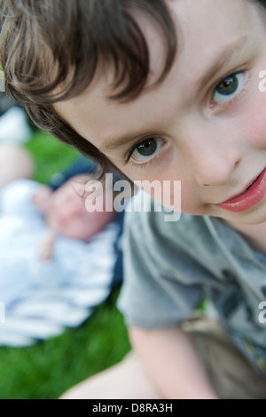 Portrait of a boy looking up at the camera Stock Photo - Alamy