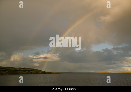 Rainbow over Whitefish lake in an area called The Barrenlands, Northwest Territories, Canada. Stock Photo