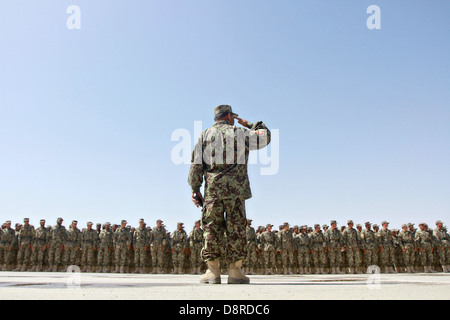 Afghan National Army soldiers stand in formation during the graduation of the 215th Corps Regional Military Training Center's Reception, Staging, Onward Movement and Integration training May 23, 2013 at Camp Shorabak, Helmand Province, Afghanistan. More than 500 soldiers graduated from the program and will be deployed replacing departing US soldiers. Stock Photo