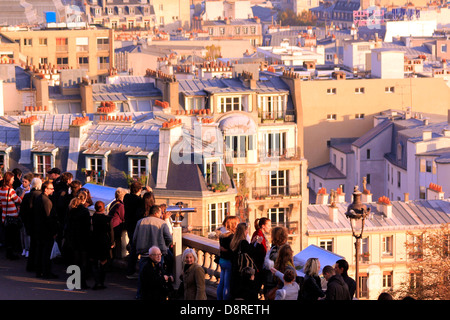 Bunch of tourist looking at Paris on sunset from Montmartre Stock Photo