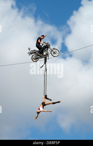 Motorbike stunt rider with girl Albert Park Melbourne Victoria Australia Stock Photo