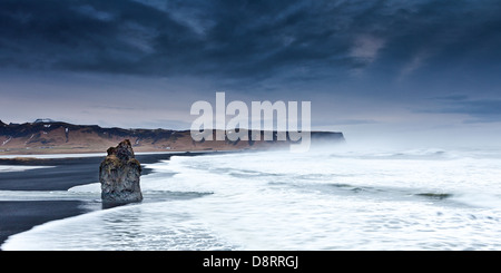 A storm coming in over a volcanic sand beach in Iceland. Stock Photo