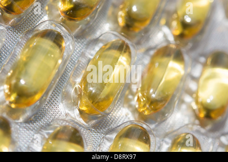 Garlic capsules (each containing 1000mg of garlic macerate, equivalent to 2400mg of fresh garlic) in a blister pack. UK, 2013. Stock Photo