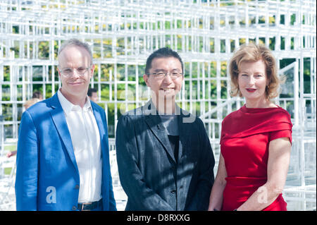 London, UK. 4th June 2013. Architect Sou Fujimoto, Julia Peyton-Jones, Director Serpentine Gallery and Hans Ulrich Obrist Co-Director Serpentine Gallery, pose for a picture at the presentation of the Serpentine Gallery  Pavilion 2013 designed by multi award-winning Japanese architect Sou Fujimoto. He is the thirteenth and, at 41, youngest architect to accept the invitation to design a temporary structure for the Serpentine Gallery. Credit:  Piero Cruciatti/Alamy Live News Stock Photo