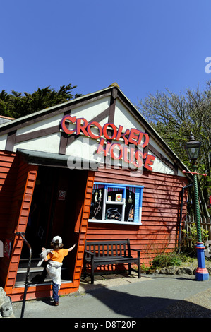 Child Entering, Crooked House, Blackgang Chine, Isle of Wight, England, UK, GB. Stock Photo