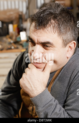 Middle-aged man in apron Stock Photo