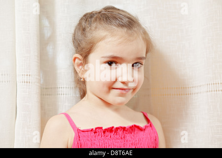 Little girl in red dress Stock Photo