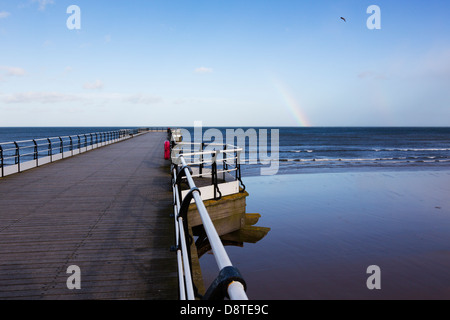Saltburn by the sea pier with a rainbow over the horizon. Stock Photo