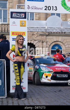 End of the Jim Clark Rally 2013 in Kelso, Scotland. At the winning post. Pirelli girl. Stock Photo