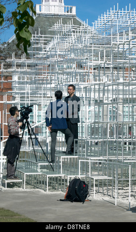 Japanese Architect Sou Fujimoto being interviewed by his newly designed 2013 Serpentine Summer Pavilion, London, UK Stock Photo