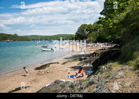 People enjoying the sandy beaches at East Portlemouth on the east side of the Kingsbridge estuary in the South Hams AONB Stock Photo