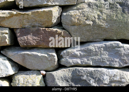 Abstract background of dry stone wall in countryside. Stock Photo