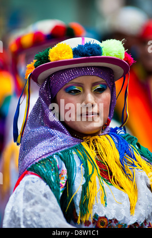 A girl dancer (danzante) performs in the religious parade within the Corpus Christi festival in Pujilí, Ecuador. Stock Photo