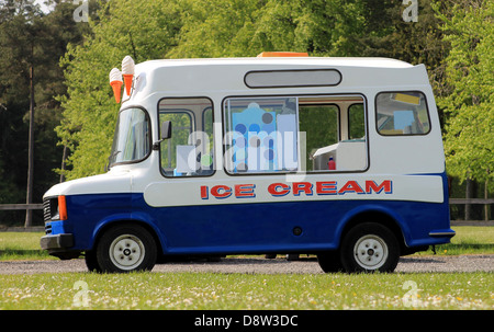 Side view of ice cream van in green countryside Stock Photo