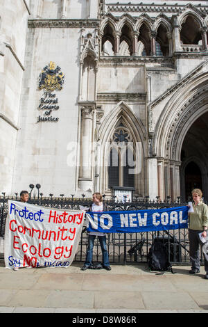 London, UK. 5th June 2013. UK Coal are seeking a judicial review, in the High Court today, of a decision by the Inspector of the Secretary of state to refuse permission for an open cast mine at Bradley, Co Durham. Protestors attempt to highlight the environmental and community impact of the potential operation. High Court, The Strand, London, UK 05 June 2013. Credit:  Guy Bell/Alamy Live News Stock Photo