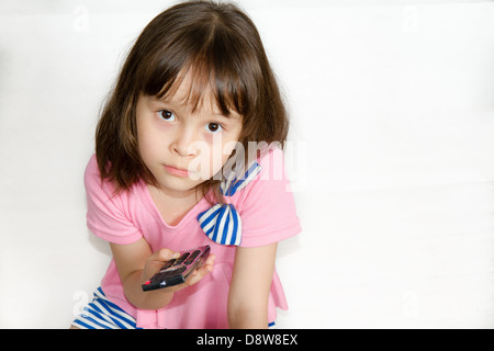 Asian child with remote control Stock Photo