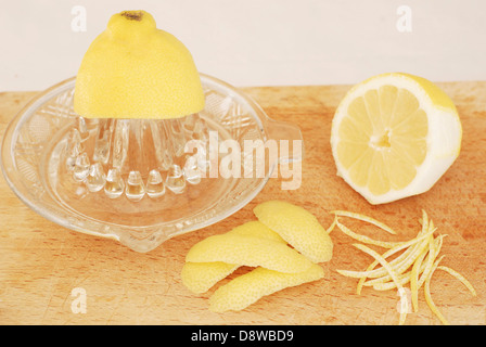 Squeezing a lemon and making zests and rinds Stock Photo