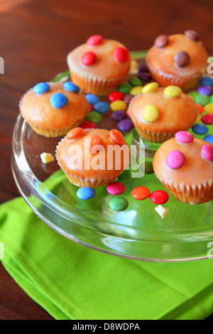 Mini cupcakes decorated with Smarties Stock Photo
