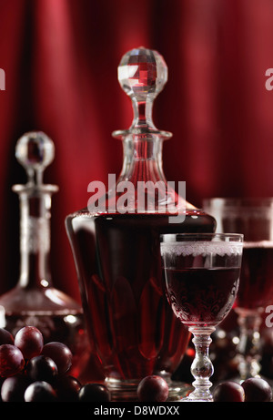 Crystal decanter and glasses of red wine Stock Photo