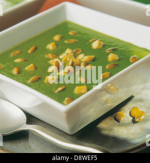 Pea soup with squash seeds Stock Photo