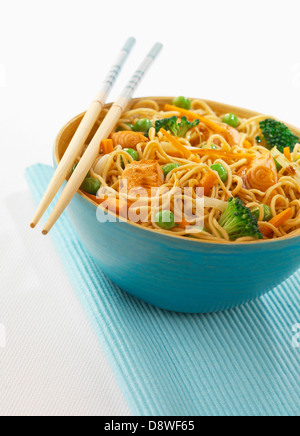 Chinese noodles with salmon,peas and broccoli Stock Photo