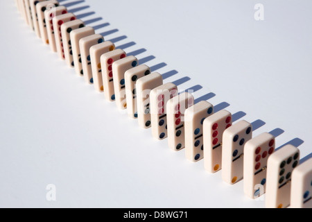 Close up of domino tiles in row on white background, studio shot Stock Photo
