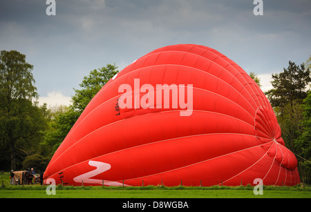 Inflating a hot air balloon in preparation for a flight over South Lanarkshire Scotland Stock Photo