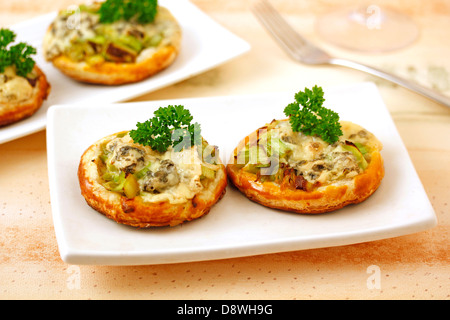 Tartlets with leek and blue cheese. Recipe available. Stock Photo