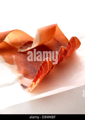Slices of raw ham Stock Photo