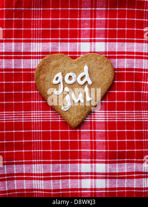 Christmas gingerbread on checked tablecloth Stock Photo