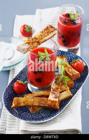 French toast and summer fruit soup with fresh mint Stock Photo