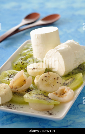 Petits-suisses with fruit and kiwi puree Stock Photo