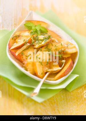 Peach and nectarine fruit salad with ginger and frsh mint Stock Photo