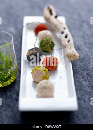 Different flavored small foie gras balls Stock Photo