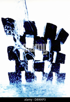 Falling ice cubes in water splashes isolated on white background Stock ...