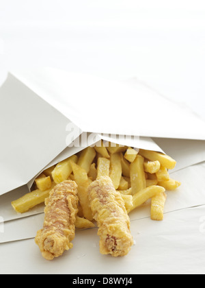 two battered sausages sausage chips in paper takeaway Stock Photo