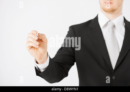 man writing something in the air Stock Photo